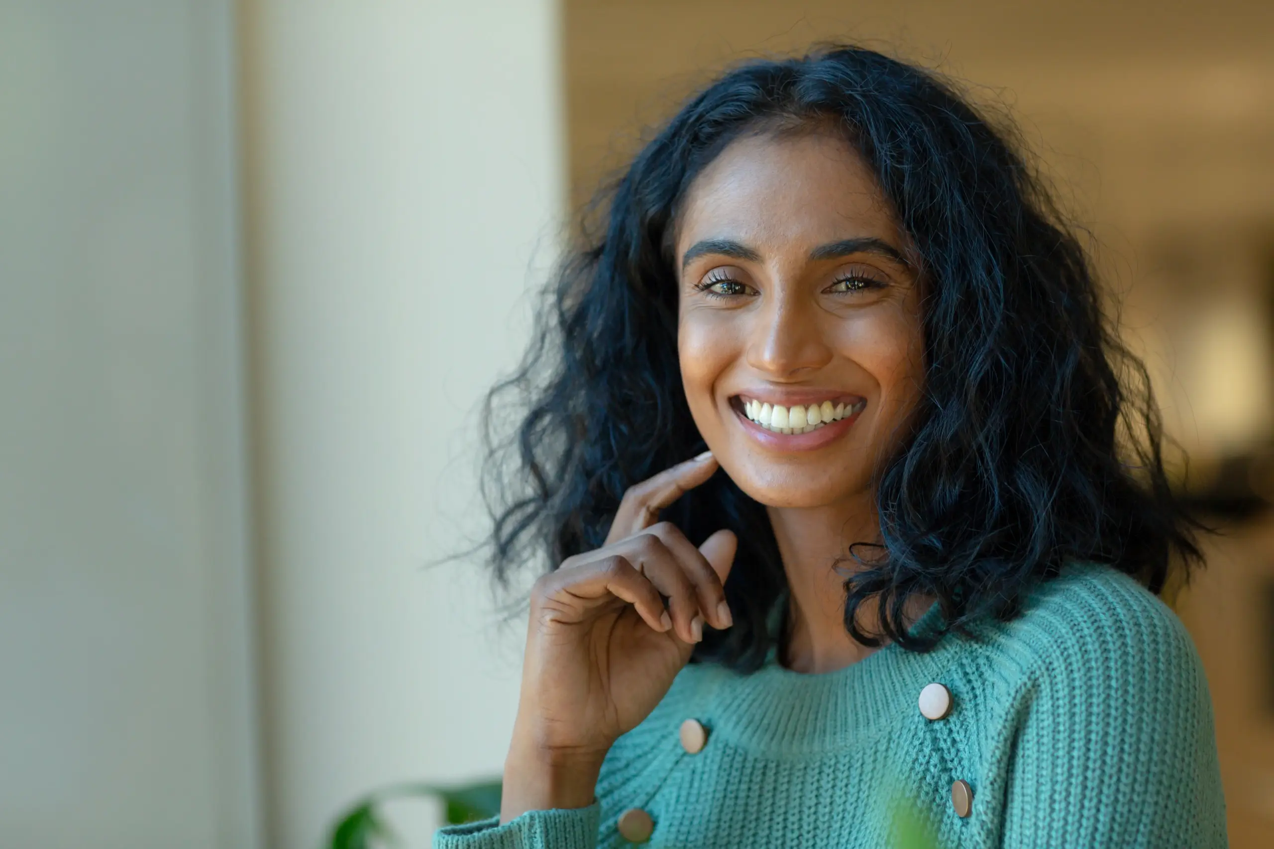 Woman in Philadelphia, PA with healthy smile after restorative dental treatment